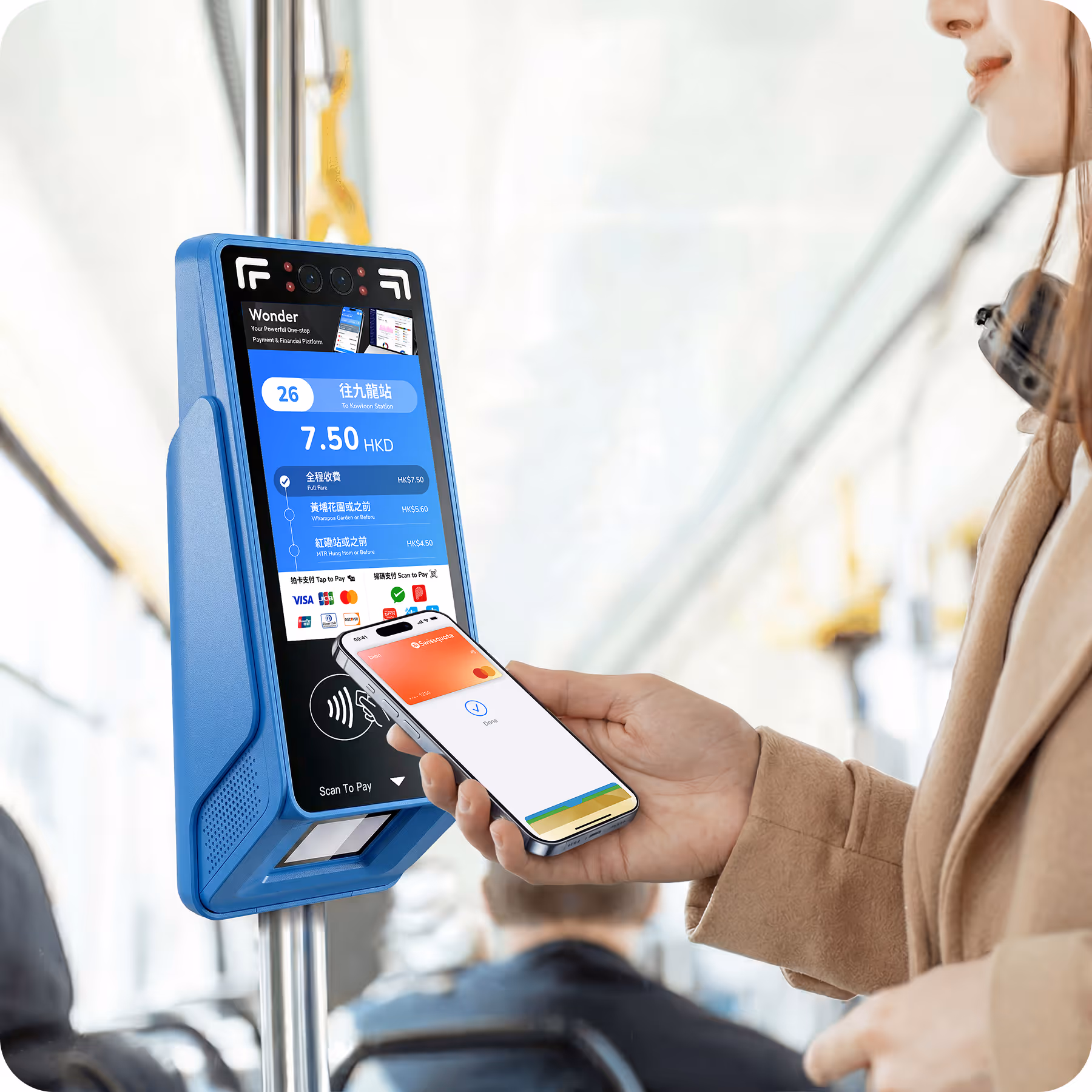 Passenger paying a bus fare with a mobile wallet on a Wonder Transit X validator